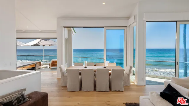 a living room with a fireplace and a flat screen tv