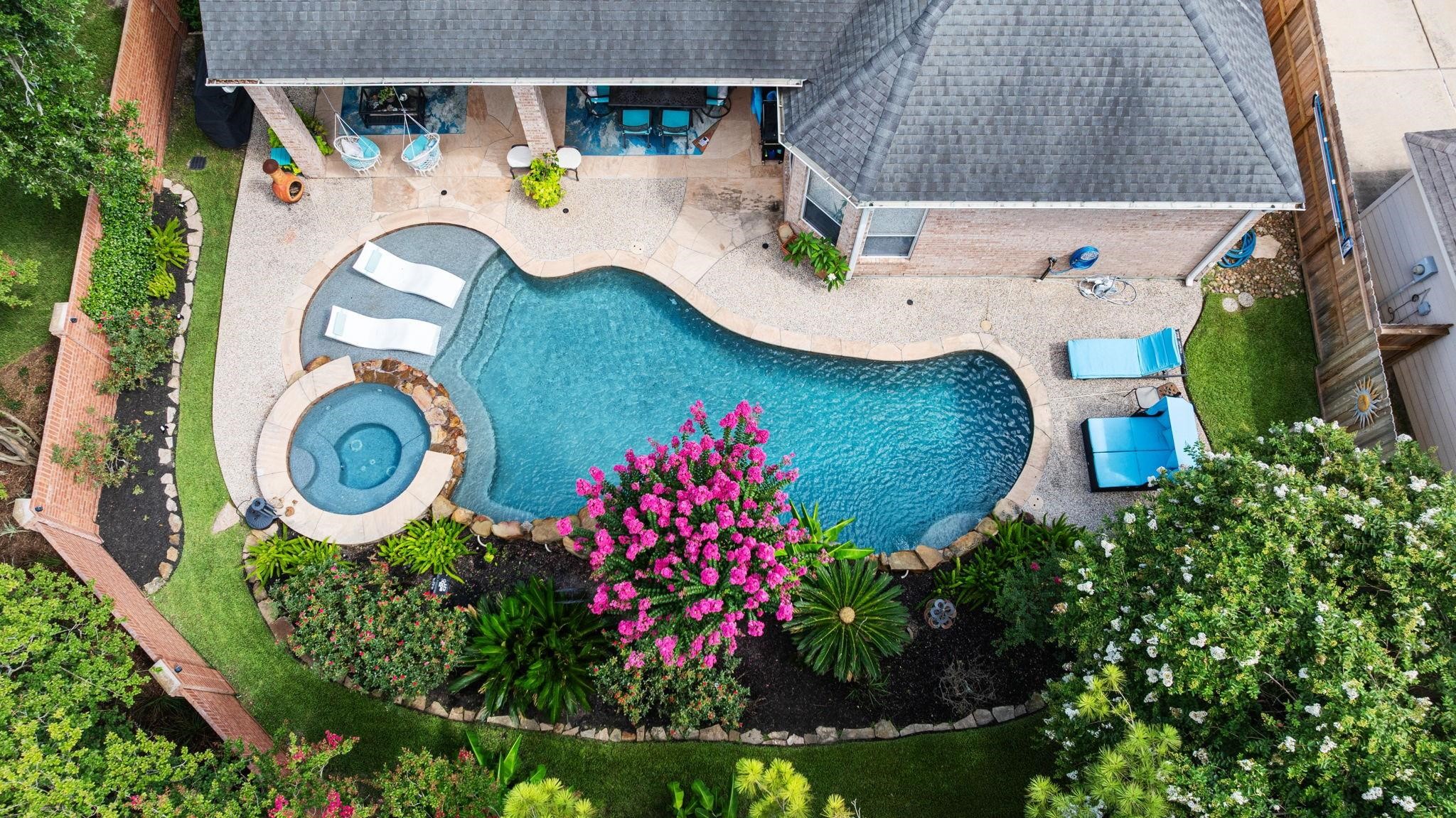 4402 Eden Point Lane Katy, TX 77494 - Photo 6 of 39 HOME SWEET HOME! This is a beautiful aerial view of the outdoor paradise with pool,spa, sun tanning ledge with tropical landscaping, mosquito mister, tranquil setting for relaxation. No backdoor neighbors.