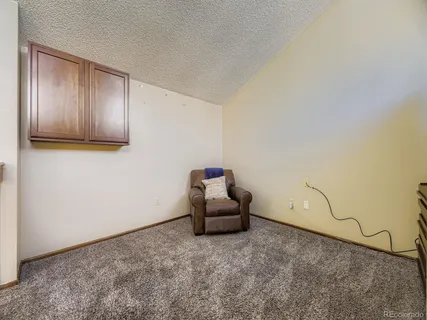 a room with a couch and a window