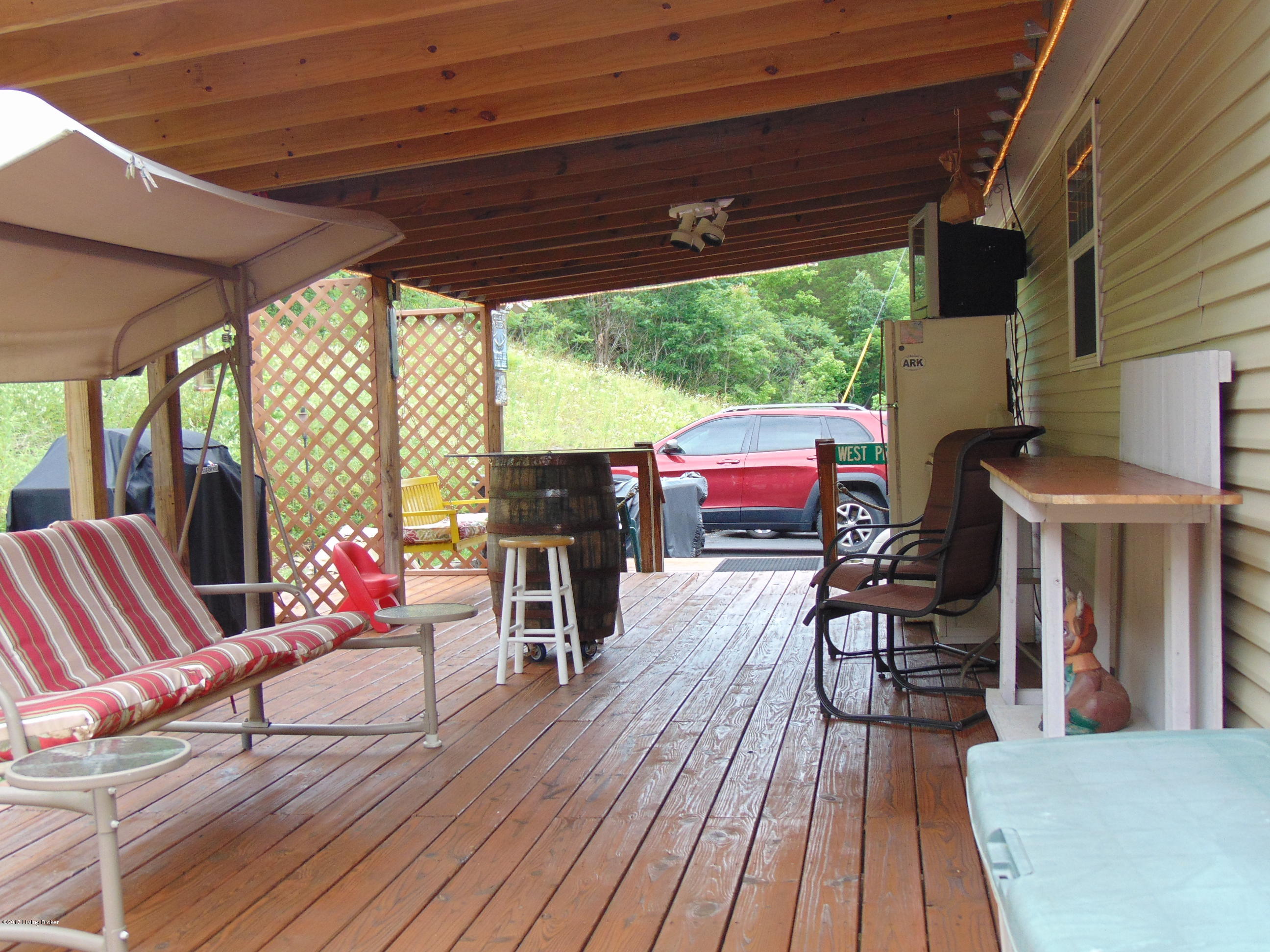532 West Prong Locust Road Milton, KY 40045 - Photo 9 of 24 Covered back porch the length of the home! Privacy and seclusion !