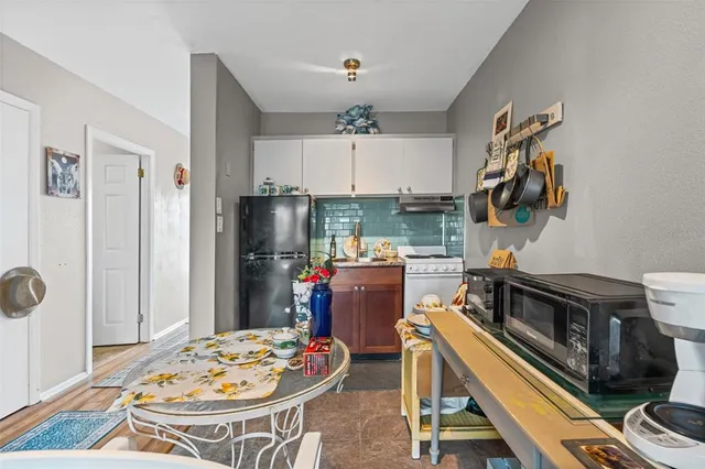 a kitchen with a table and chairs in it