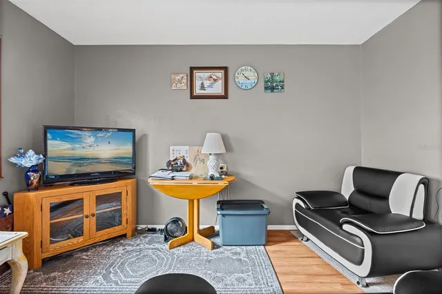 a work room with furniture and wooden floor