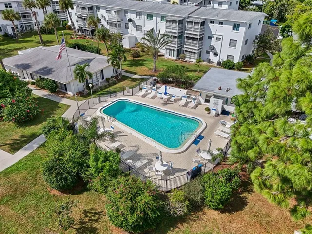 an aerial view of residential house with outdoor space and swimming pool