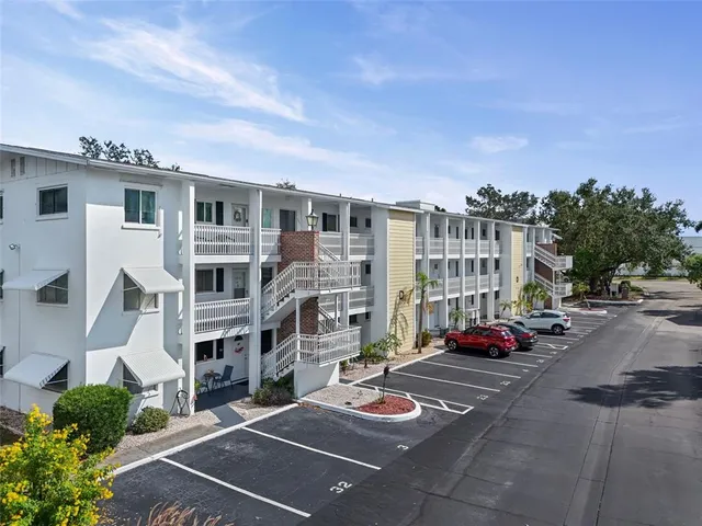 a city street lined with buildings and cars