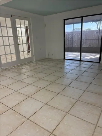 a view of an empty room with a large window