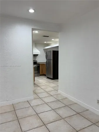 a view of a livingroom and entryway
