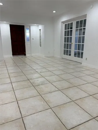 a view of empty room with windows