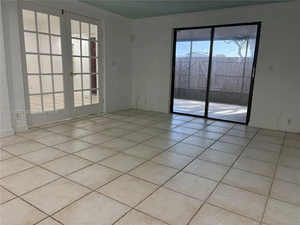 a view of an empty room and window