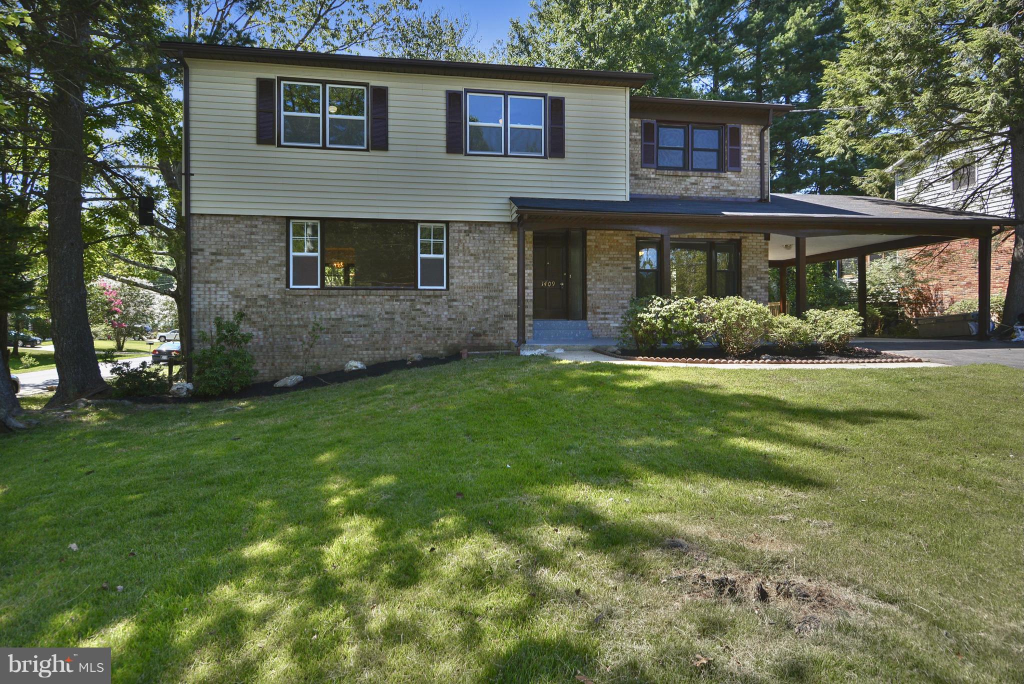 1409 Jackson Road Silver Spring, MD 20904 - Photo 1 of 30 a front view of a house with a yard