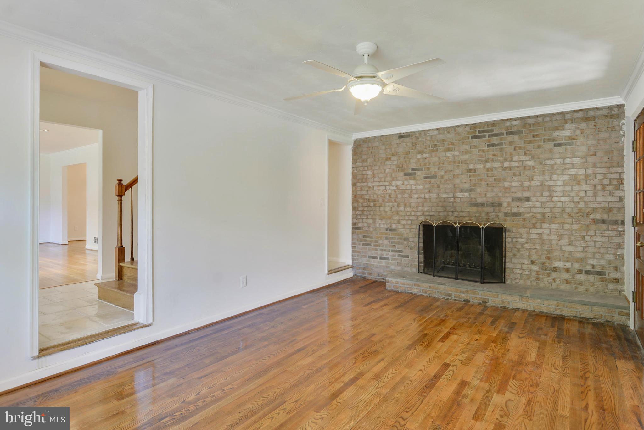 1409 Jackson Road Silver Spring, MD 20904 - Photo 14 of 30 a view of empty room with wooden floor and a fireplace