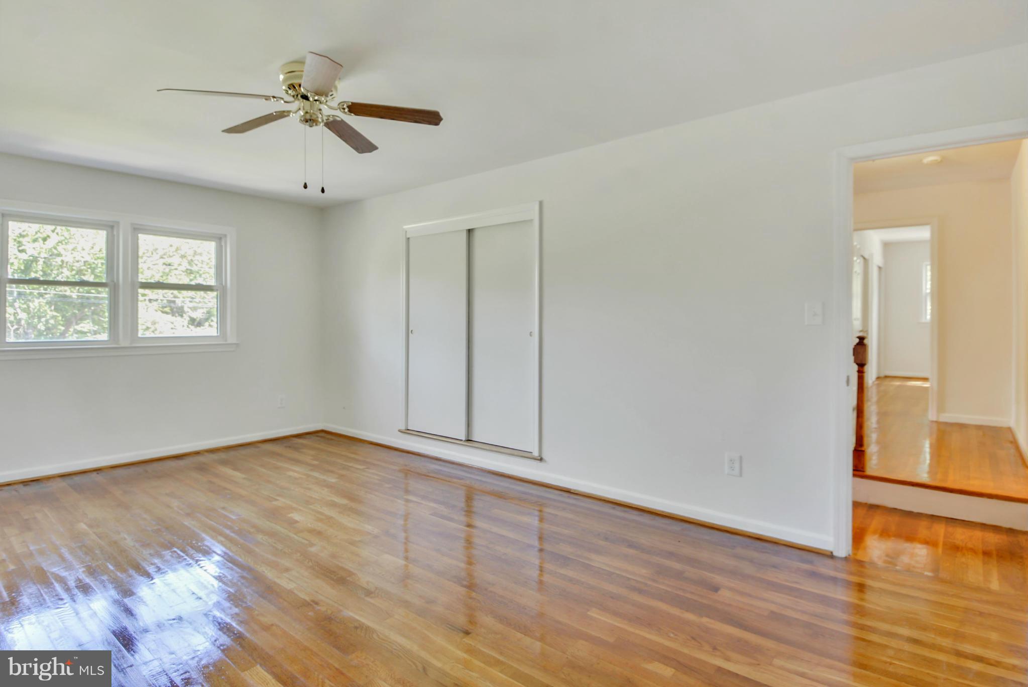 1409 Jackson Road Silver Spring, MD 20904 - Photo 18 of 30 a view of an empty room with wooden floor and a window