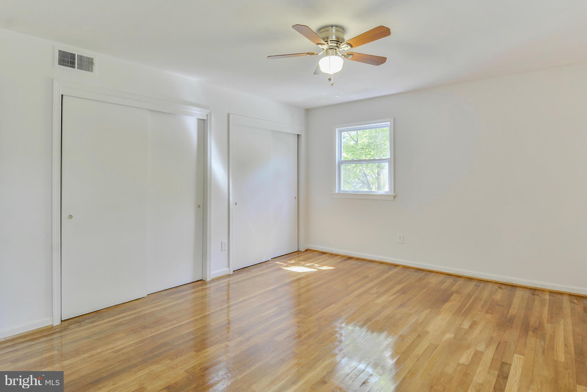 1409 Jackson Road Silver Spring, MD 20904 - Photo 19 of 30 wooden floor in an empty room with a window