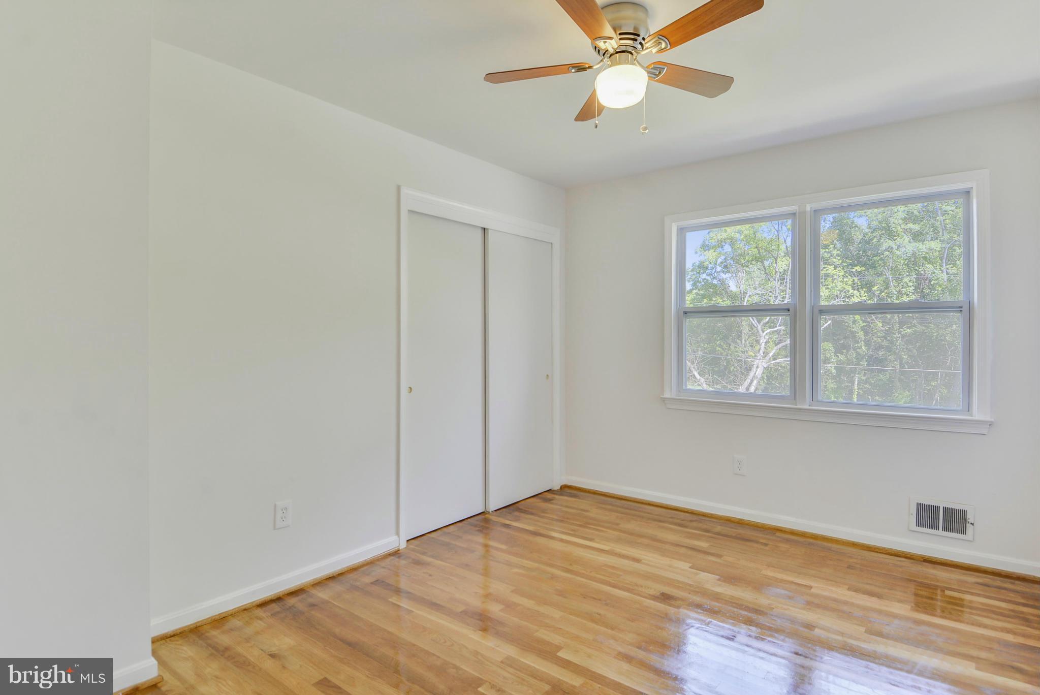 1409 Jackson Road Silver Spring, MD 20904 - Photo 21 of 30 a view of empty room with wooden floor and fan