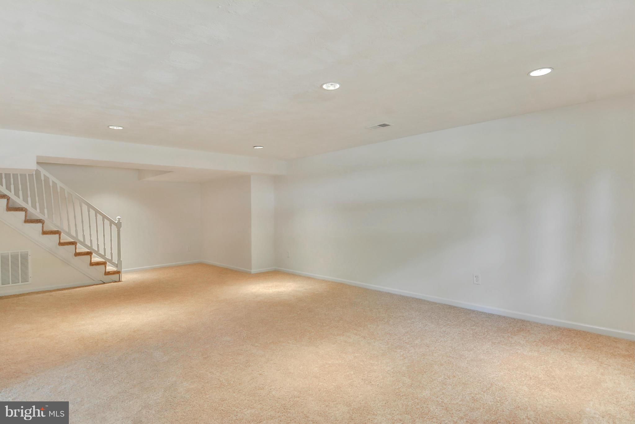 1409 Jackson Road Silver Spring, MD 20904 - Photo 24 of 30 a view of an empty room with stairs