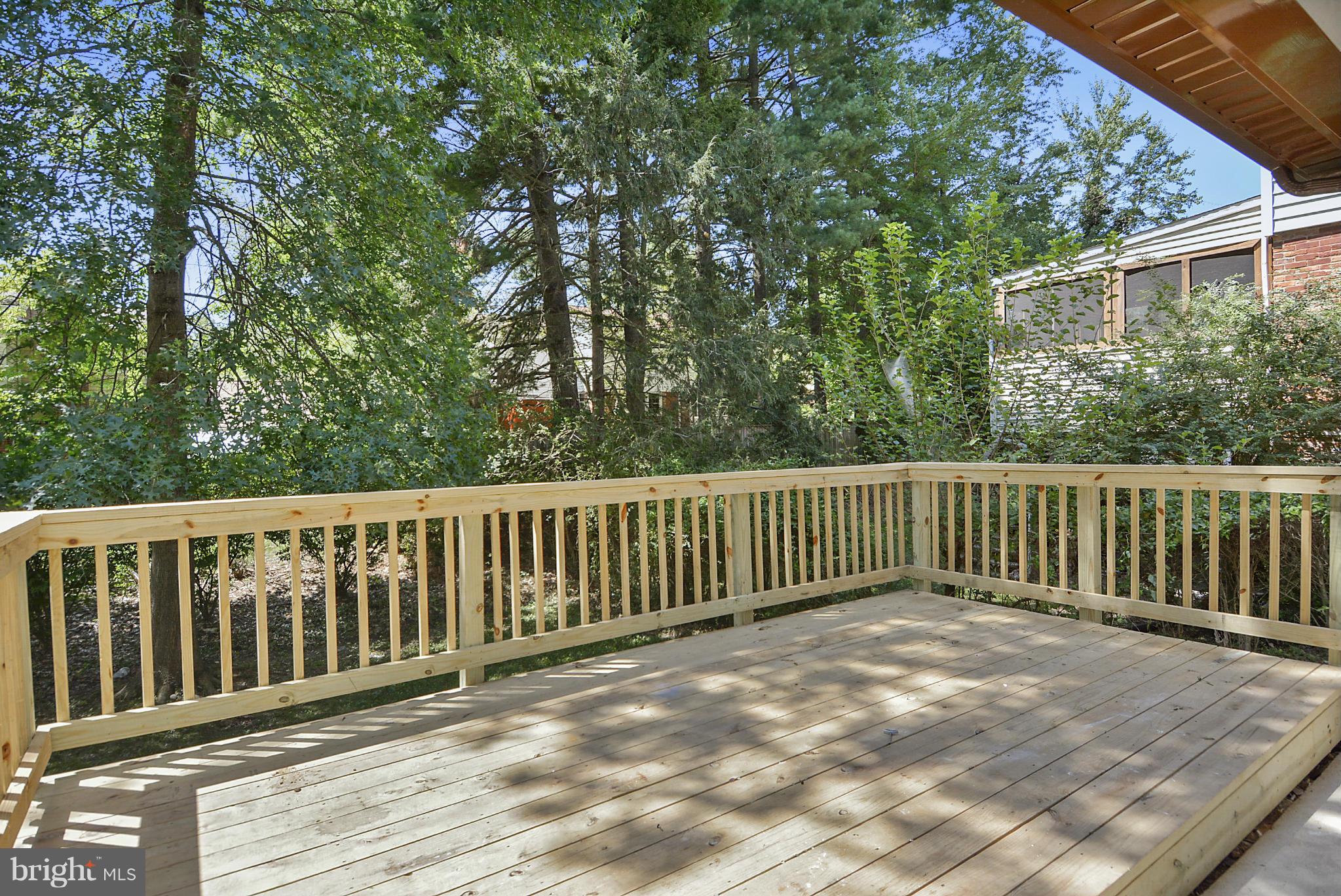 1409 Jackson Road Silver Spring, MD 20904 - Photo 26 of 30 a balcony with wooden floor and fence