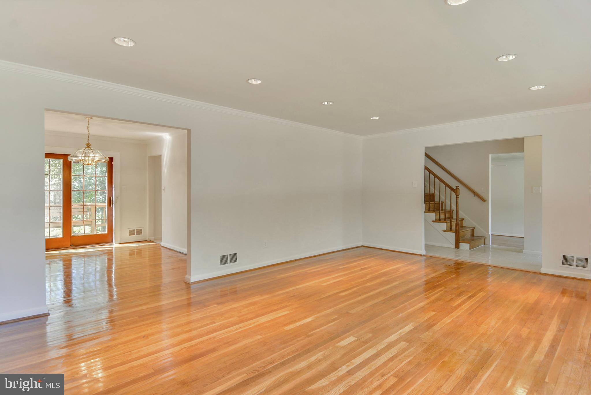 1409 Jackson Road Silver Spring, MD 20904 - Photo 7 of 30 a view of an empty room with wooden floor and a window
