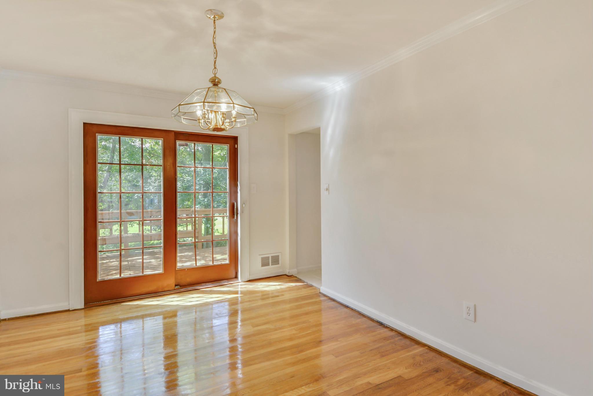 1409 Jackson Road Silver Spring, MD 20904 - Photo 9 of 30 a view of an empty room with wooden floor and a window