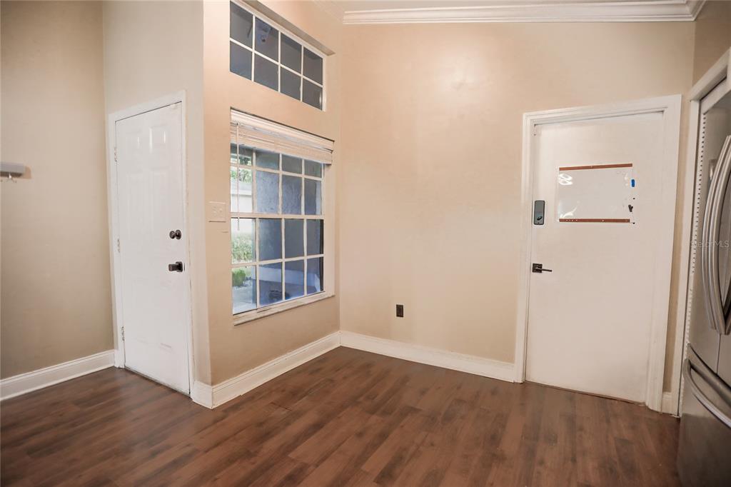 2083 Windward Pass Lakeland, FL 33813 - Photo 3 of 15 a view of an empty room with wooden floor and a window