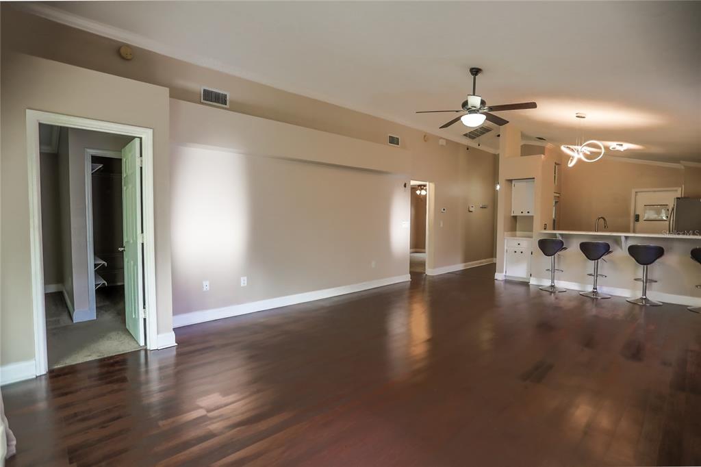 2083 Windward Pass Lakeland, FL 33813 - Photo 4 of 15 a view of a livingroom with a ceiling fan window and wooden floor