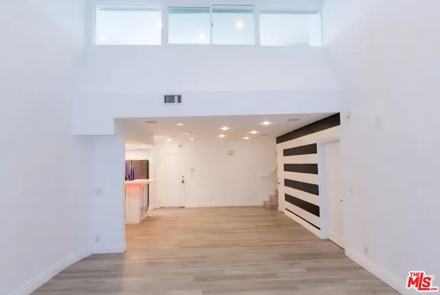 a view of room with stairs and a window