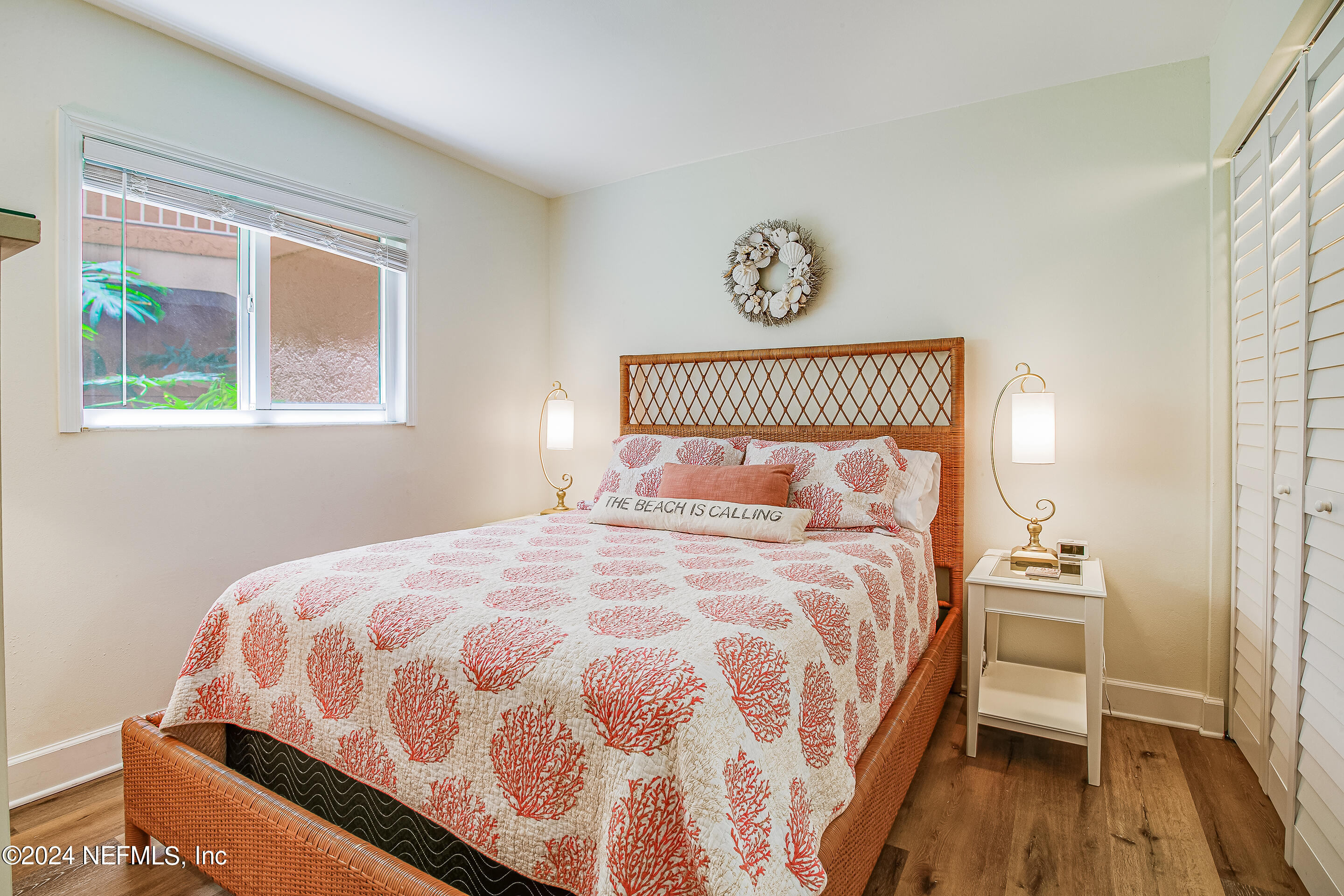 4 Ocean Trace Road, Unit 102 St. Augustine, FL 32080 - Photo 16 of 37 a bedroom with a bed and a window