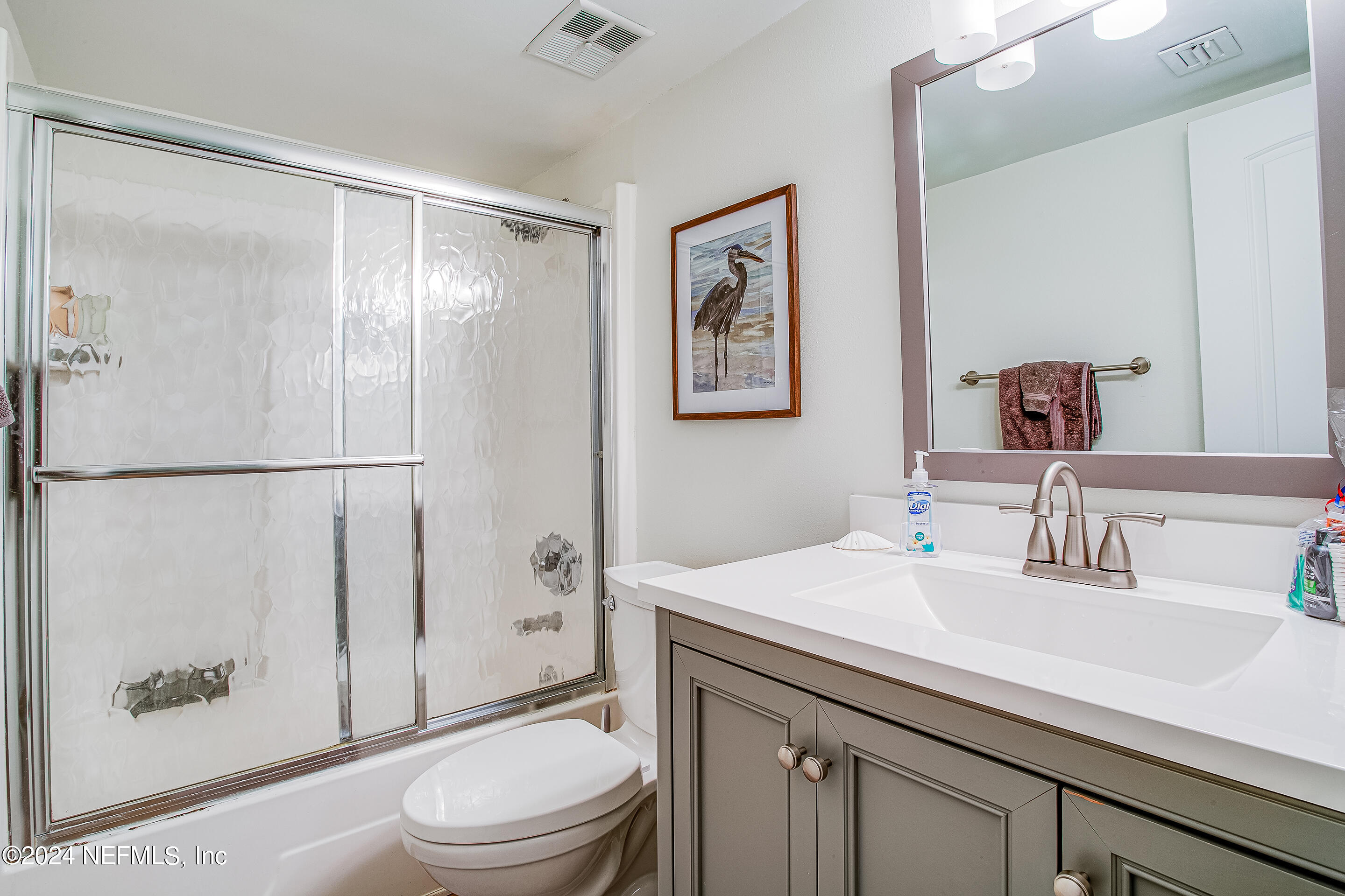 4 Ocean Trace Road, Unit 102 St. Augustine, FL 32080 - Photo 18 of 37 a bathroom with a sink a toilet and shower