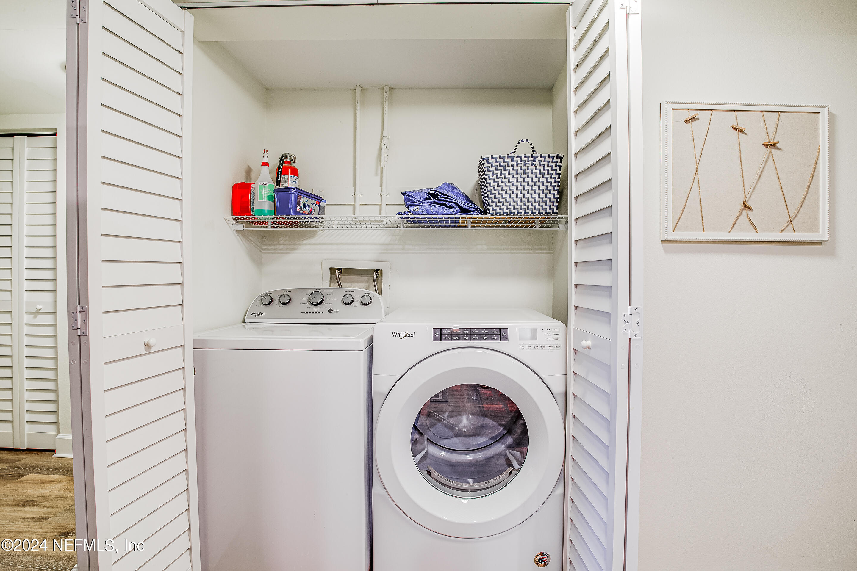 4 Ocean Trace Road, Unit 102 St. Augustine, FL 32080 - Photo 5 of 37 a utility room with dryer and washer