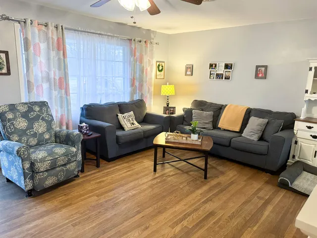 a dining room with furniture and window