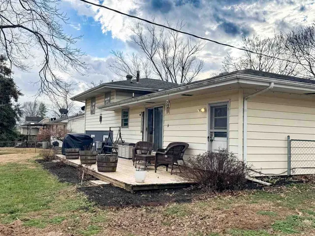a view of a patio with couches chairs and a fire pit