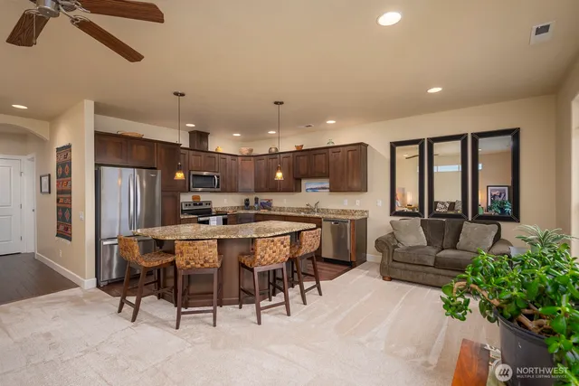 a large kitchen with a table and chairs
