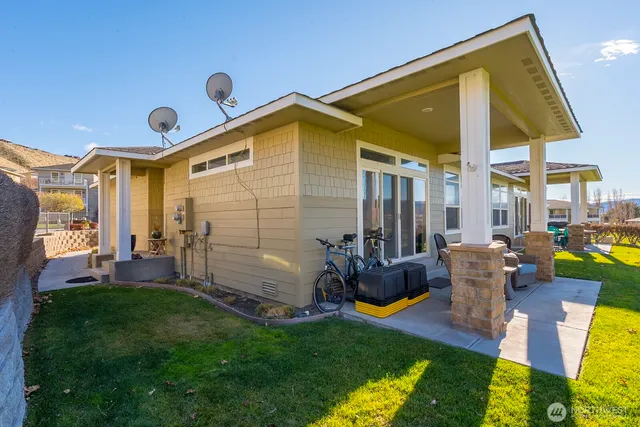 a front view of house with yard and outdoor seating