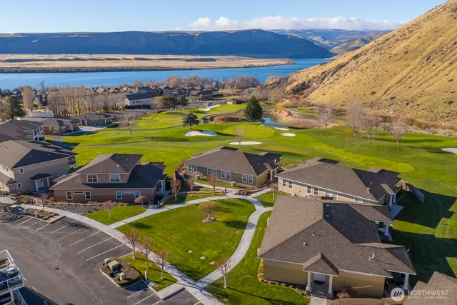 a view of a swimming pool with an outdoor space and seating area