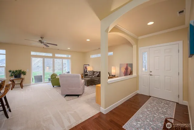 a living room with furniture and a rug
