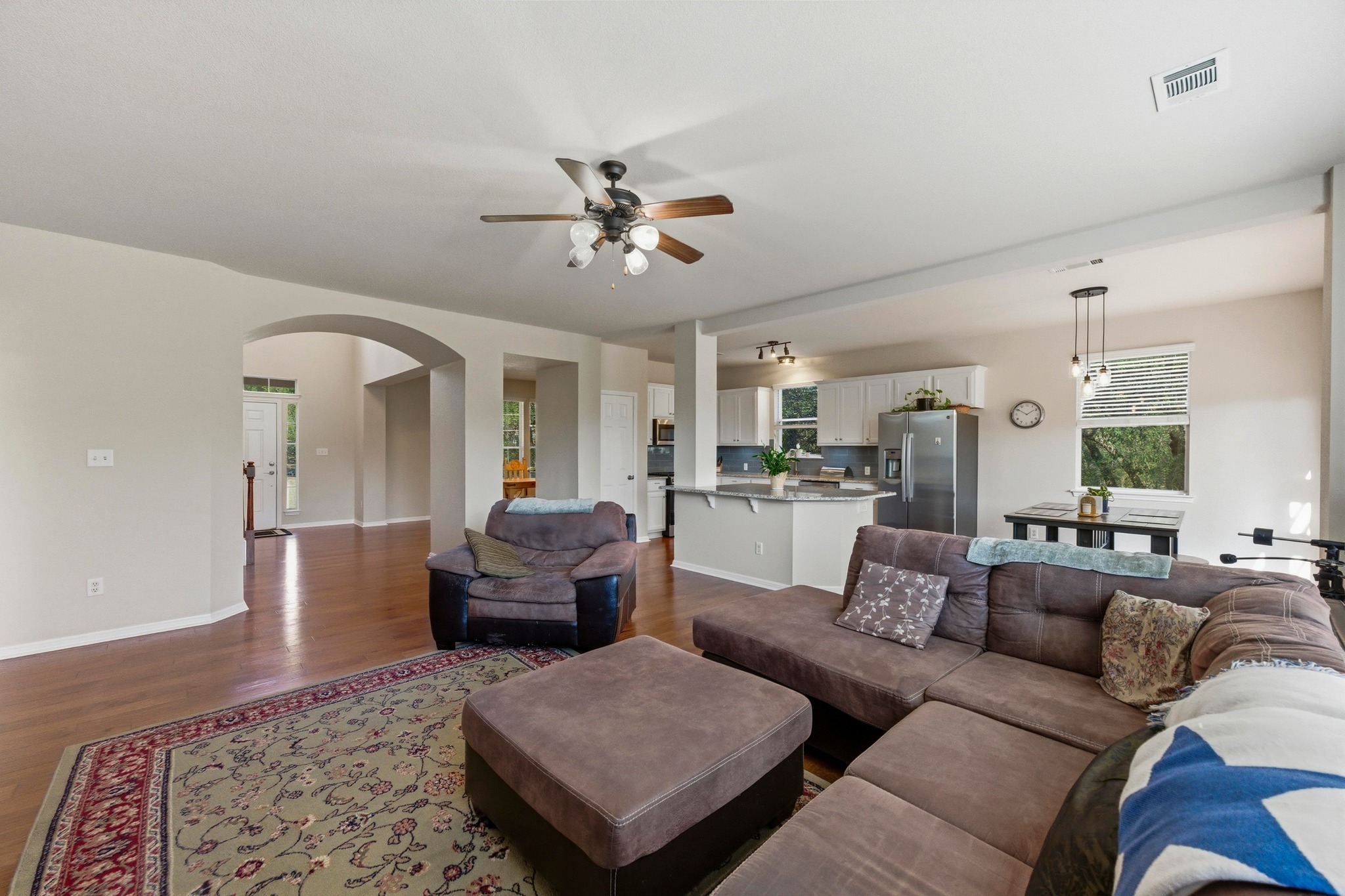 7805 Pitter Pat Lane Austin, TX 78736 - Photo 11 of 40 a living room with furniture ceiling fan and a rug