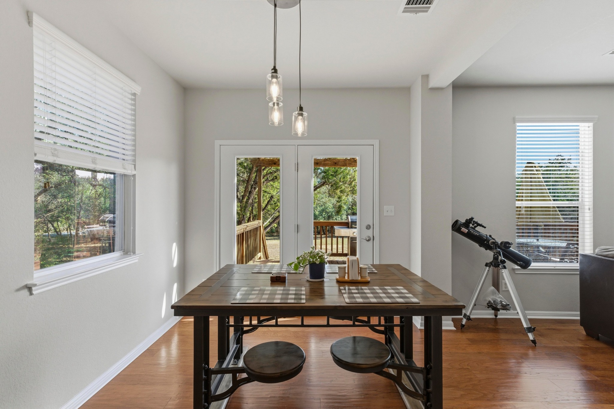 7805 Pitter Pat Lane Austin, TX 78736 - Photo 17 of 40 a view of a dining room with furniture window and wooden floor