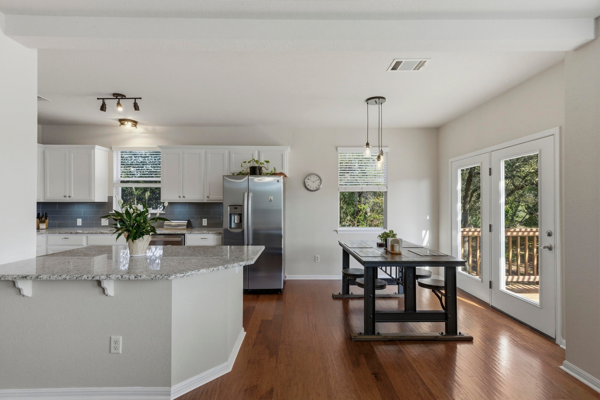 7805 Pitter Pat Lane Austin, TX 78736 - Photo 18 of 40 a kitchen with refrigerator and table chair