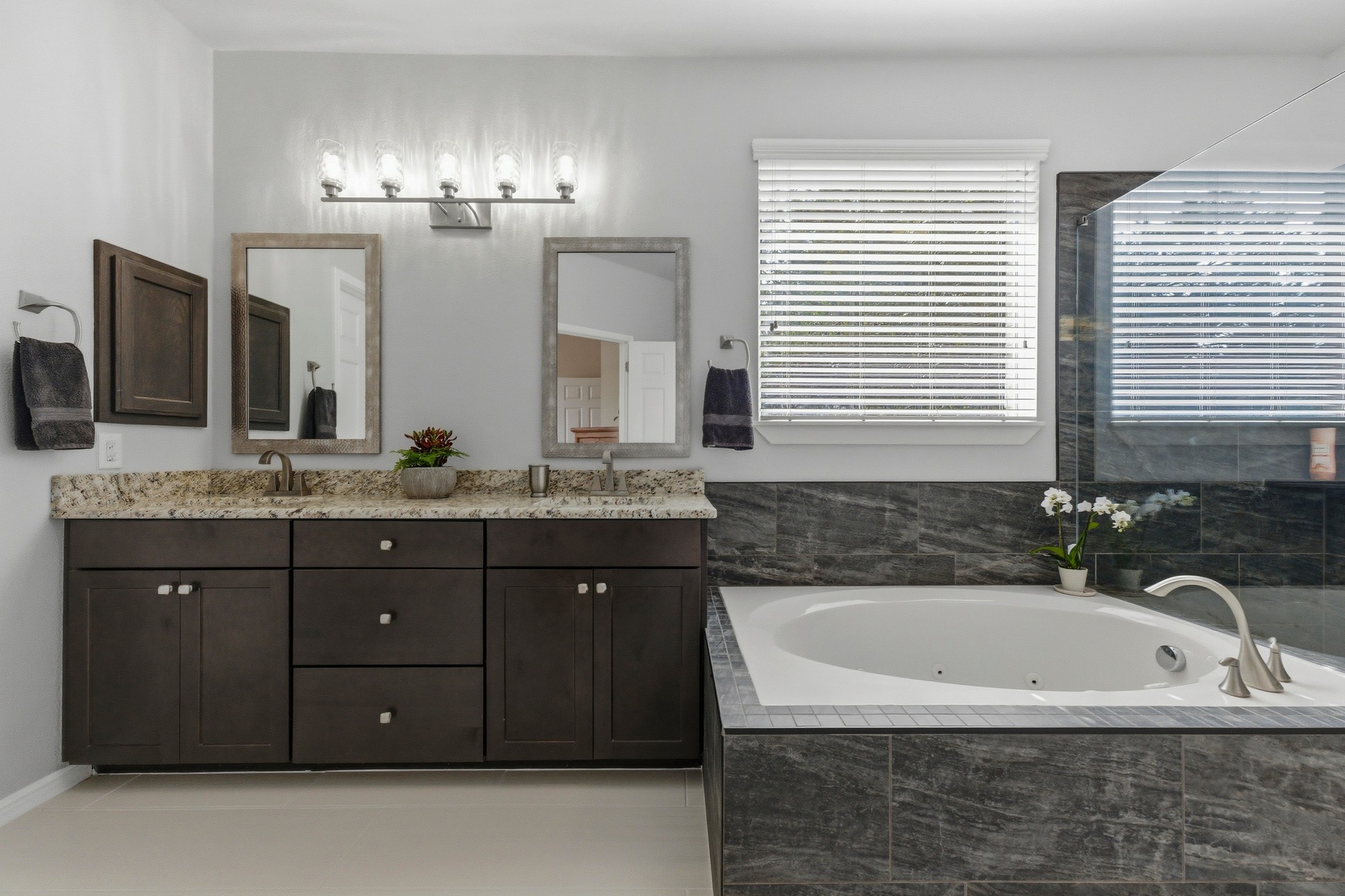 7805 Pitter Pat Lane Austin, TX 78736 - Photo 21 of 40 a spacious bathroom with a granite countertop tub sink and mirror