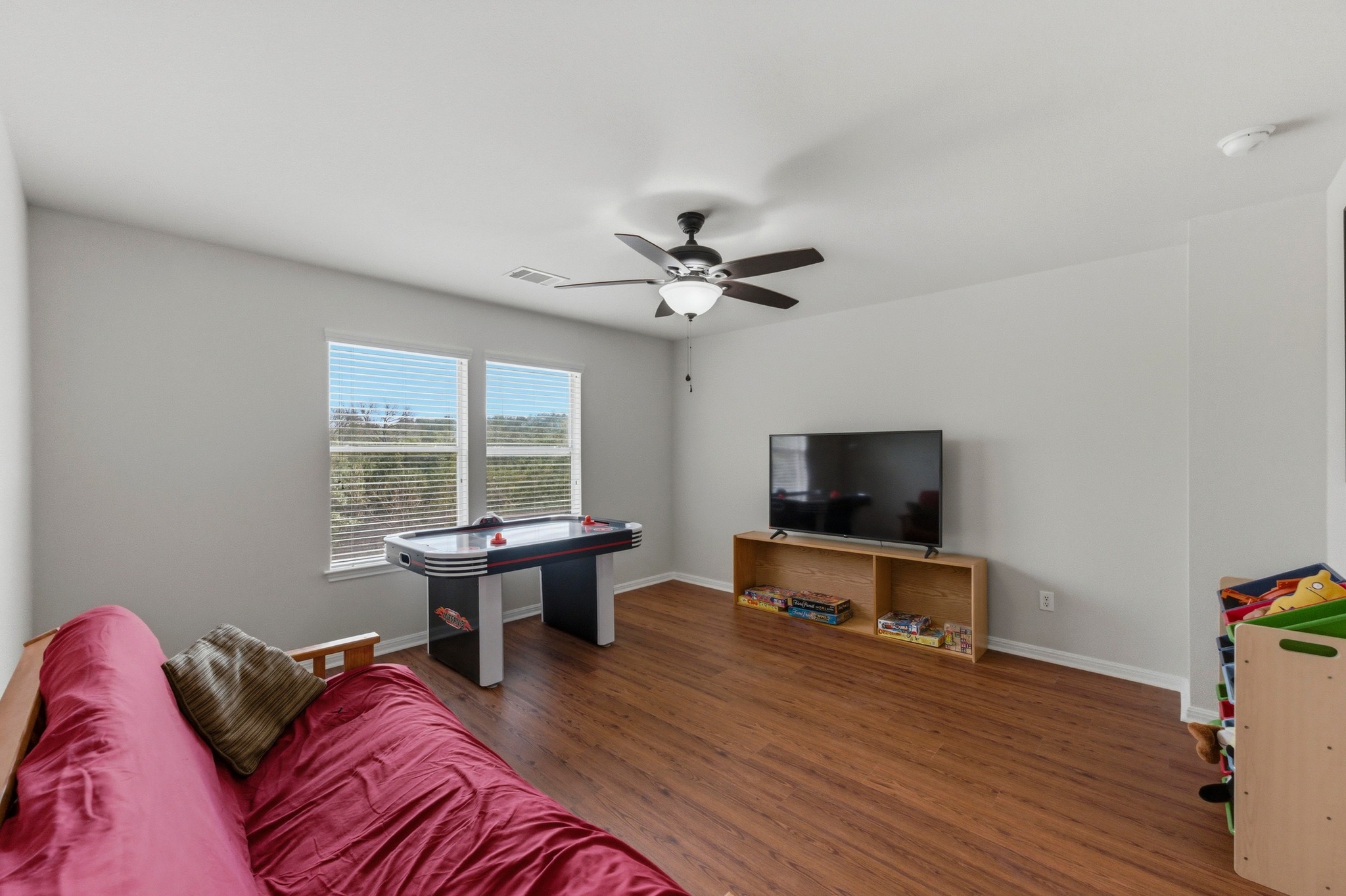 7805 Pitter Pat Lane Austin, TX 78736 - Photo 24 of 40 a living room with furniture a flat screen tv and a large window