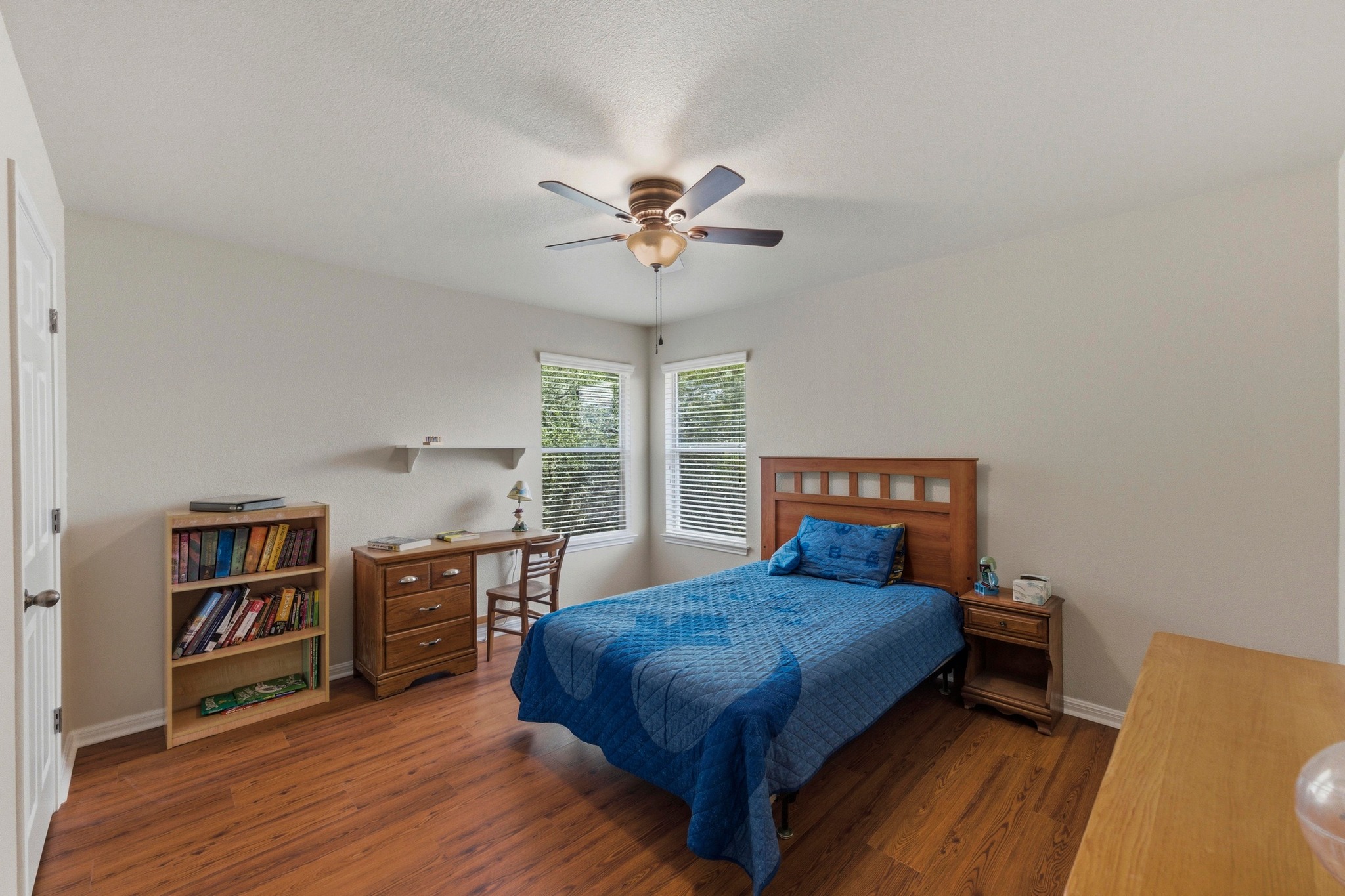 7805 Pitter Pat Lane Austin, TX 78736 - Photo 26 of 40 a bedroom with a bed furniture and a large window