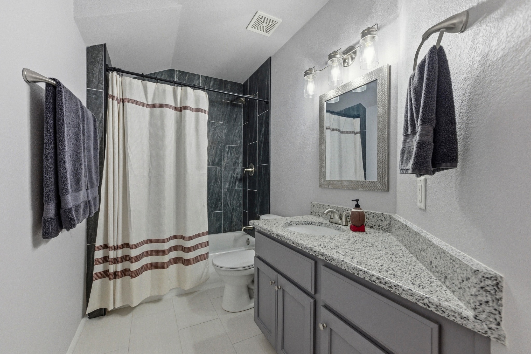 7805 Pitter Pat Lane Austin, TX 78736 - Photo 27 of 40 a bathroom with a granite countertop sink and a mirror