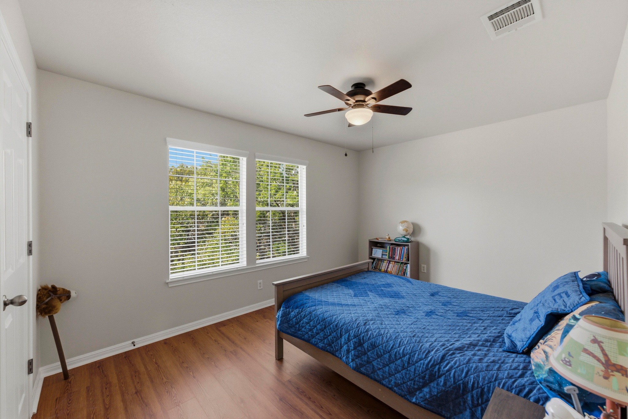 7805 Pitter Pat Lane Austin, TX 78736 - Photo 28 of 40 a bedroom with a bed and a window