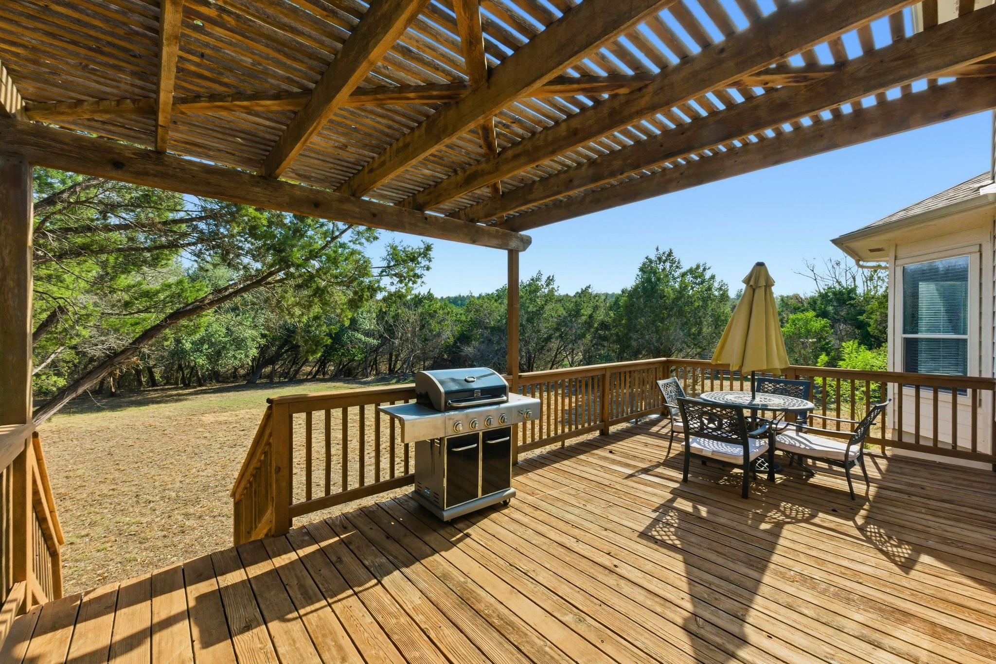 7805 Pitter Pat Lane Austin, TX 78736 - Photo 30 of 40 a view of balcony with wooden floor and outdoor seating