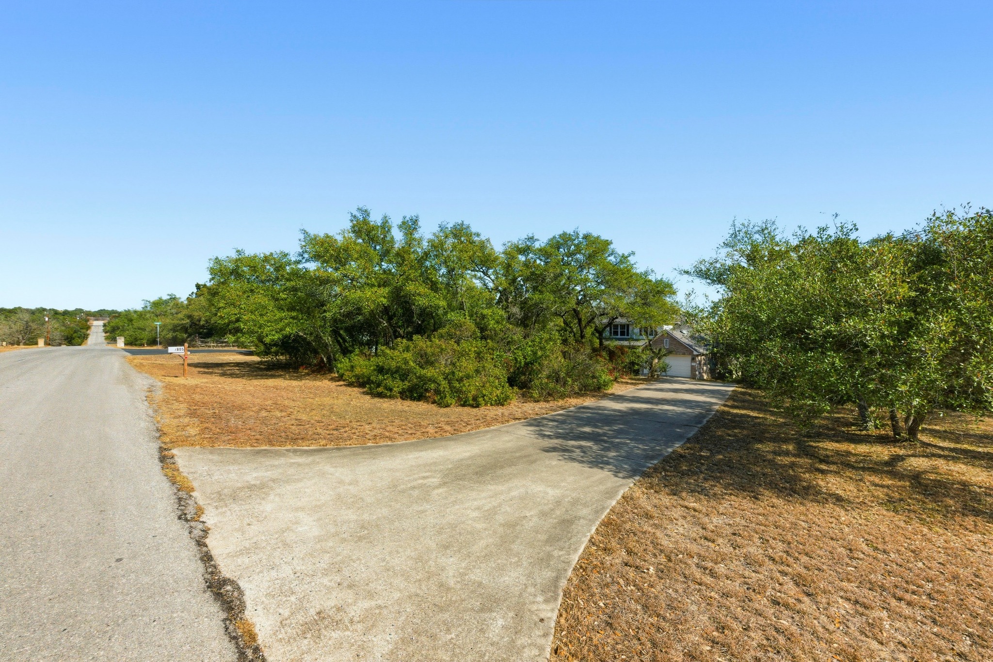 7805 Pitter Pat Lane Austin, TX 78736 - Photo 5 of 40 a view of a lake view with large trees