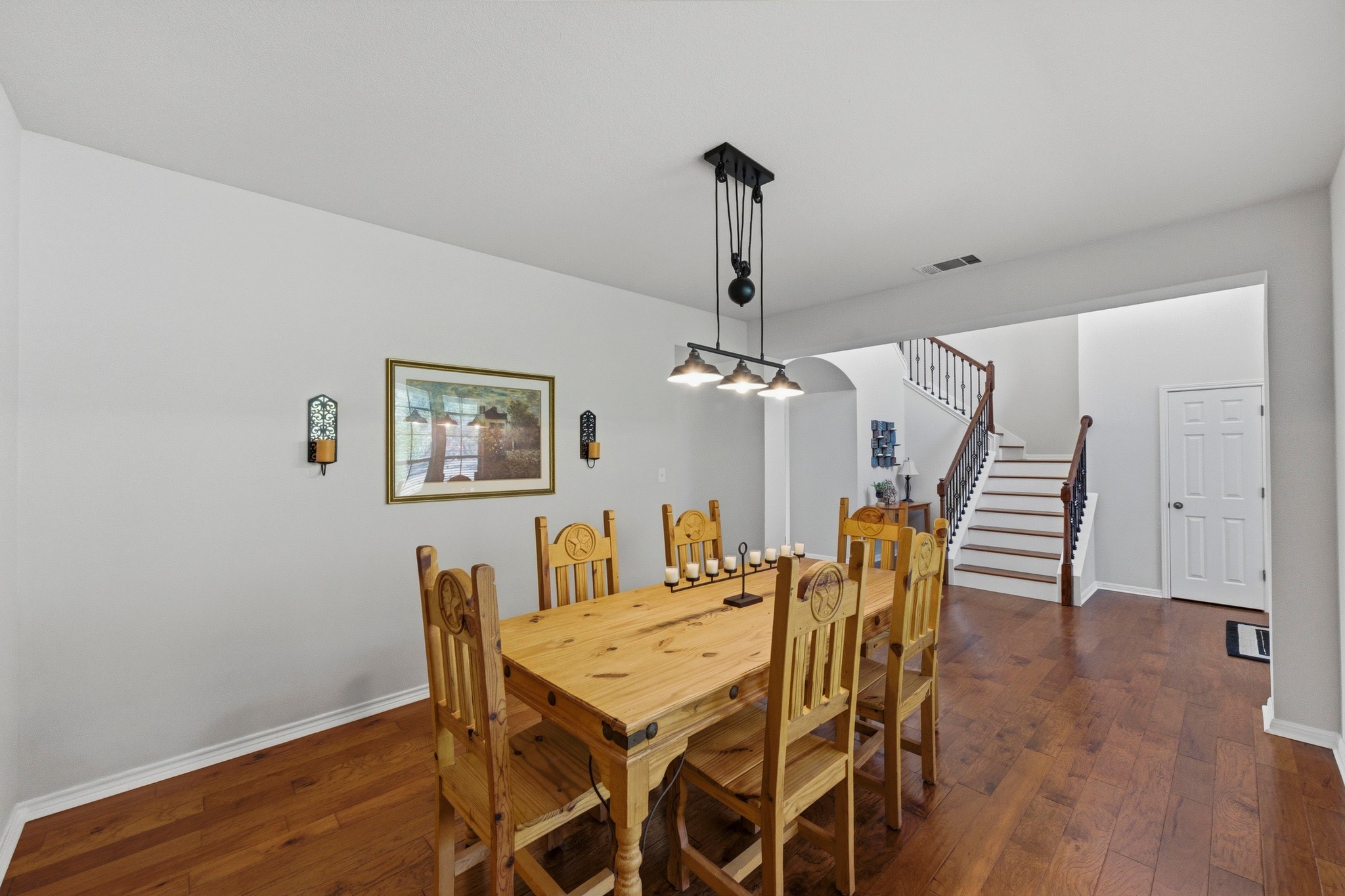 7805 Pitter Pat Lane Austin, TX 78736 - Photo 8 of 40 a view of a dining room with furniture and wooden floor