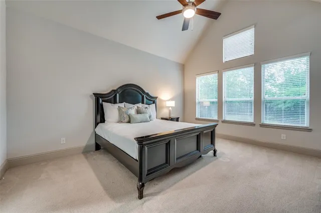 a bed sitting in a room next to a window