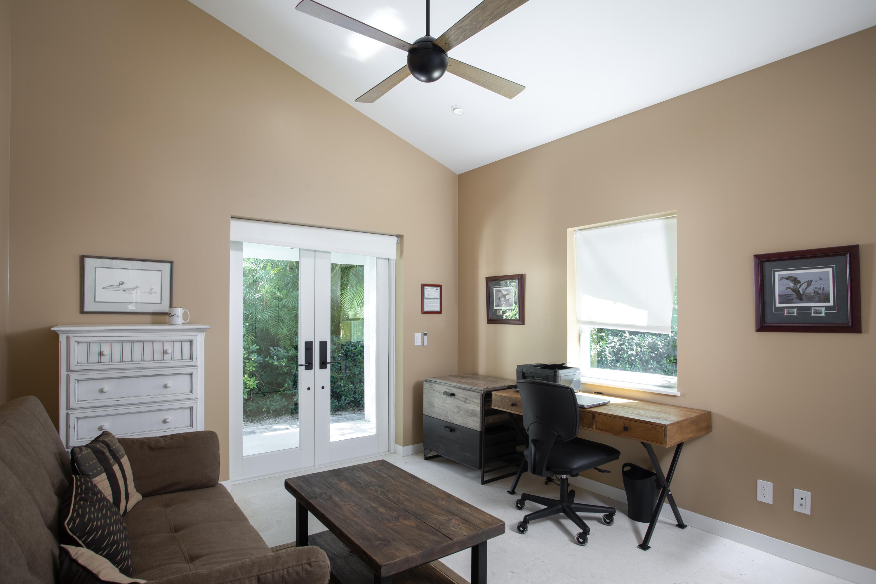 1215 Duncan Street Key West, FL 33040 - Photo 12 of 14 a living room with furniture a desk and a window