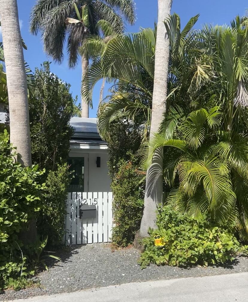 1215 Duncan Street Key West, FL 33040 - Photo 14 of 14 a front view of a multi story building with a yard