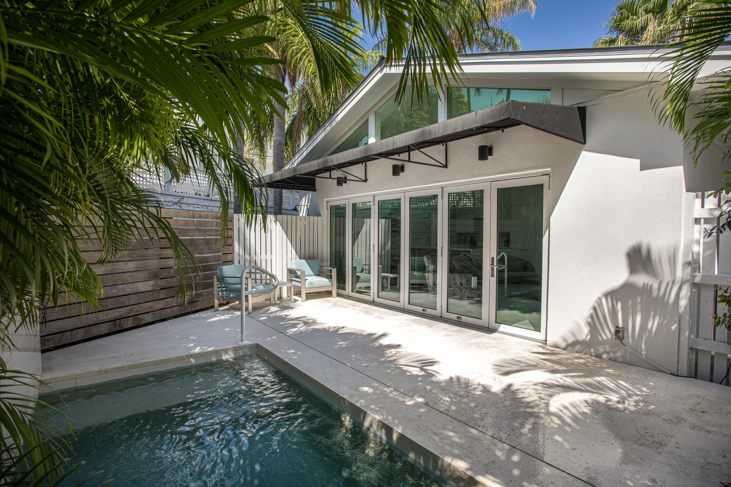 1215 Duncan Street Key West, FL 33040 - Photo 6 of 14 a view of a house with backyard and porch
