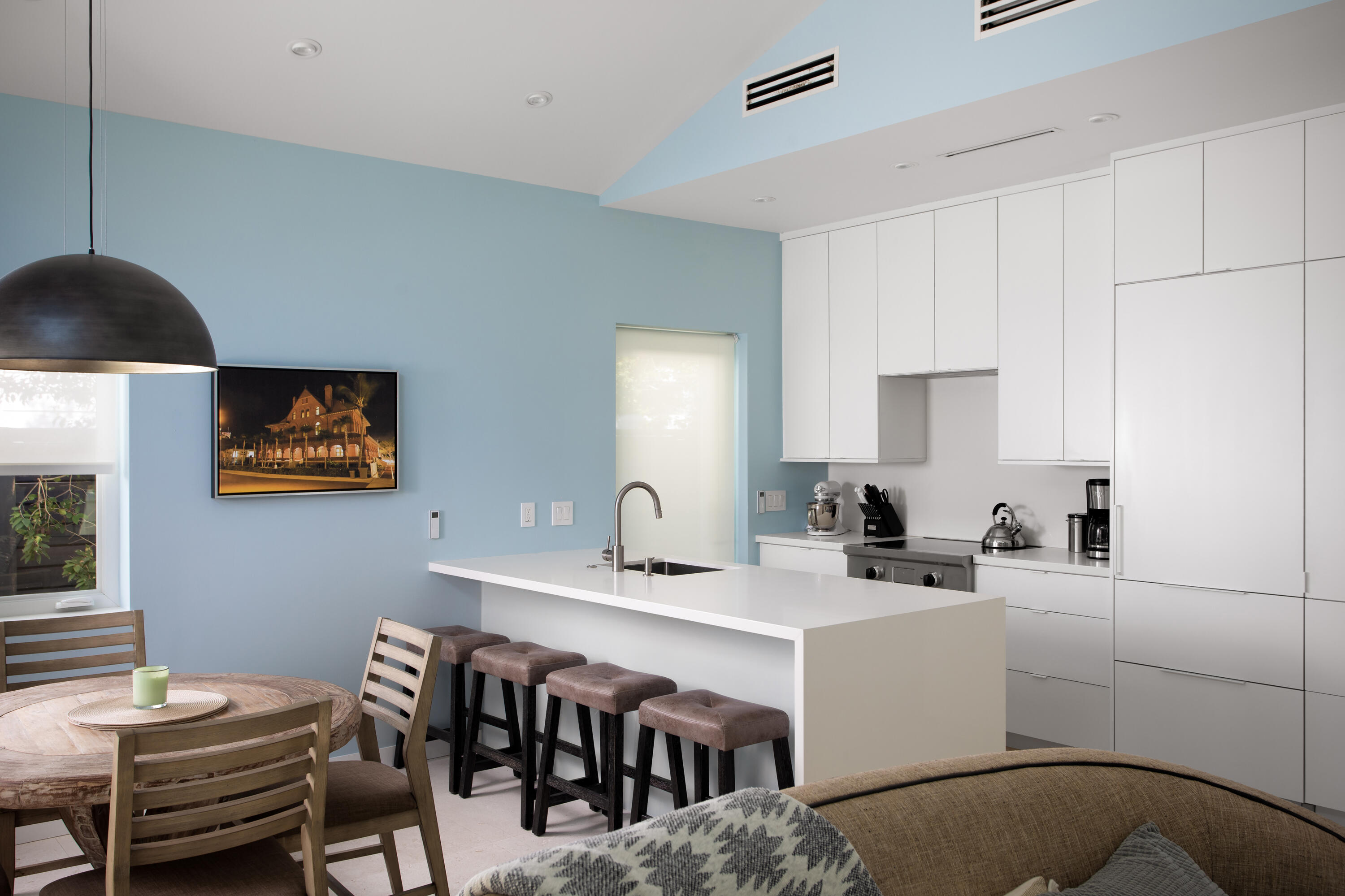 1215 Duncan Street Key West, FL 33040 - Photo 9 of 14 a kitchen with a table chairs and a workspace