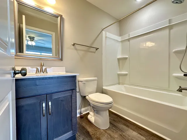 a bathroom with a sink toilet and a bathtub